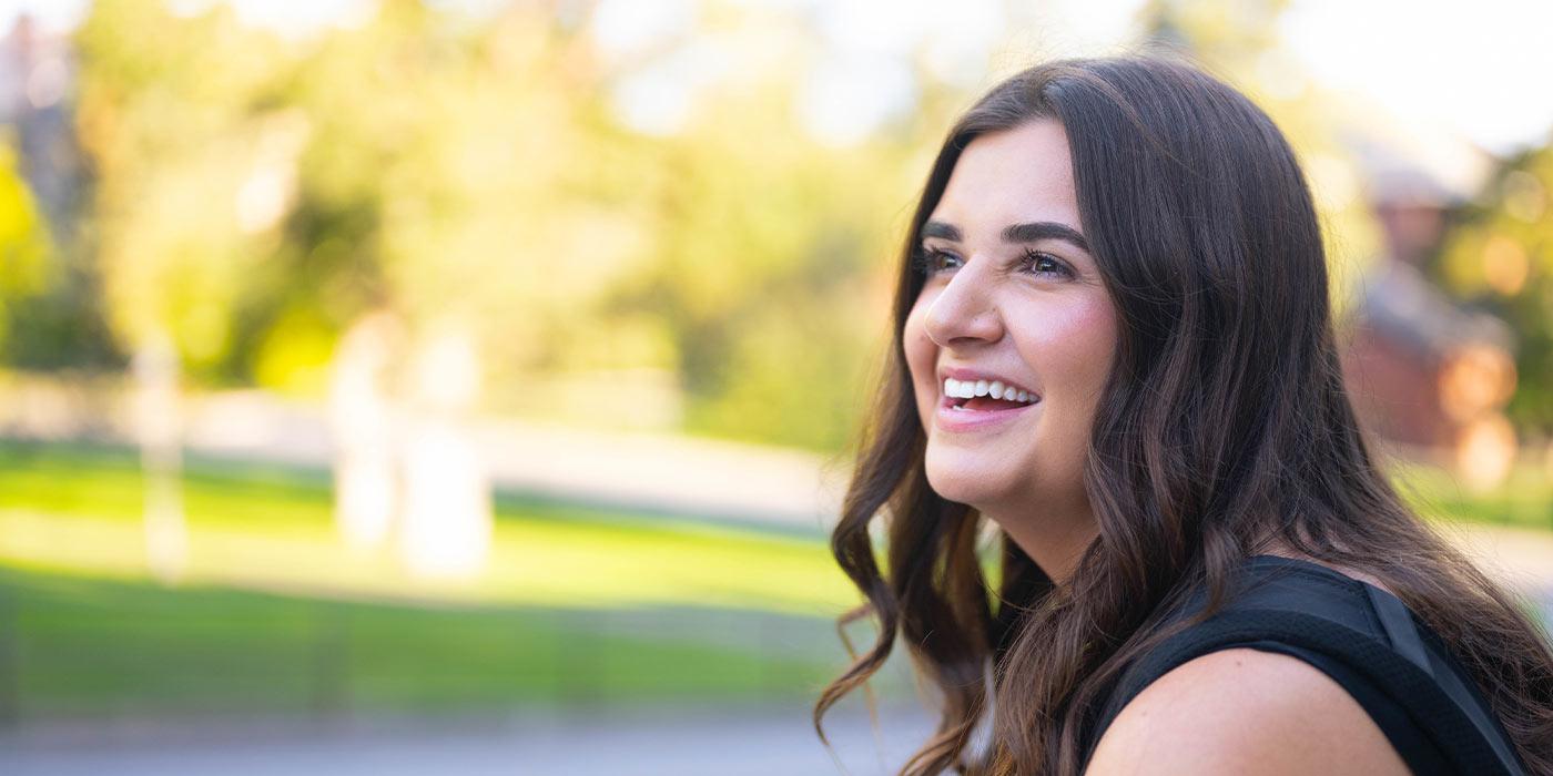 A side view of Alexandra Manolopoulos, smiling